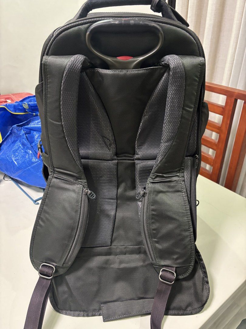 Authentic Tumi Tech Backpack Luggage with Wheels and Handle (Category: Backpacks) located in San Fernando. Submitted by destinydeals04 (Listing ID 1464572537, Image 3). Description: - Original Black Tumi Tech backpack - Features wheels and retractable handle for easy travel - Padded shoulder straps for comfort - Multiple compartments for excellent organization - Ideal for both work and travel needs.