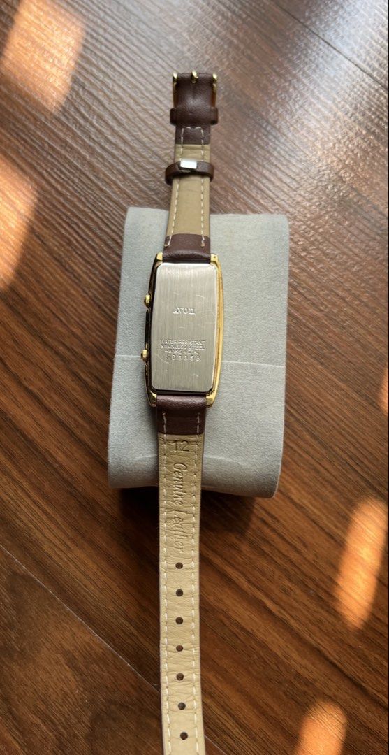 Avon Dual Time watch (Category: Women's Watches) located in Bacolor. Submitted by livephoenix (Listing ID 1464684971, Image 3). Description: - Gold tone watch - Dual dial - Genuine brown leather strap - Water resistant - Classic and timeless design.