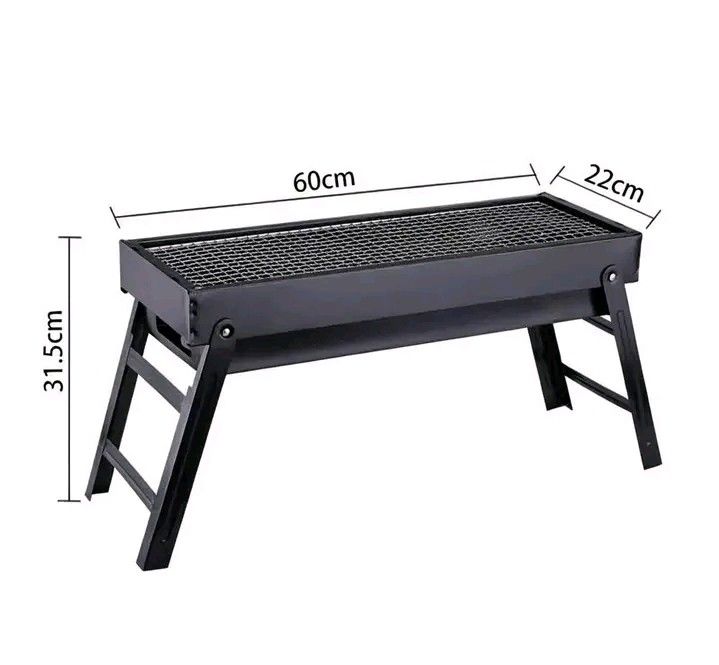 BABALE Portable Barbecue Grill Black (Category: BBQ, Grills & Hotpots) located in Manila. Submitted by berdenmarl01688 (Listing ID 1464748158, Image 2). Description: - Brand: BABALE Portable Barbecue Grill (Black) - Dimensions: 60cm (L) x 22cm (W) x 31.5cm (H) - Features folding legs for hassle-free storage and transport - Durable metal construction with a wire grill grate - Ideal for camping, balcony grilling, and outdoor hangouts - Condition: B