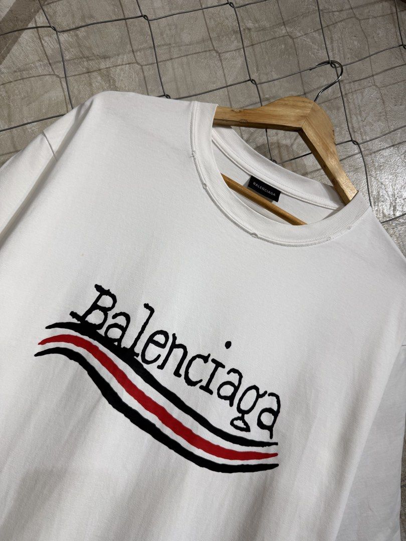 Balenciaga Campaign Logo Distressed Tee. (Category: Tshirts & Polo Shirts ) located in Manila. Submitted by ardobe.mnl (Listing ID 1464747072, Image 2). Description: Balenciaga Campaign Logo White Tee. Size: Large Dimes: 22x29 Condition: Excellent Flaw: None! Dm for inquiries!.
