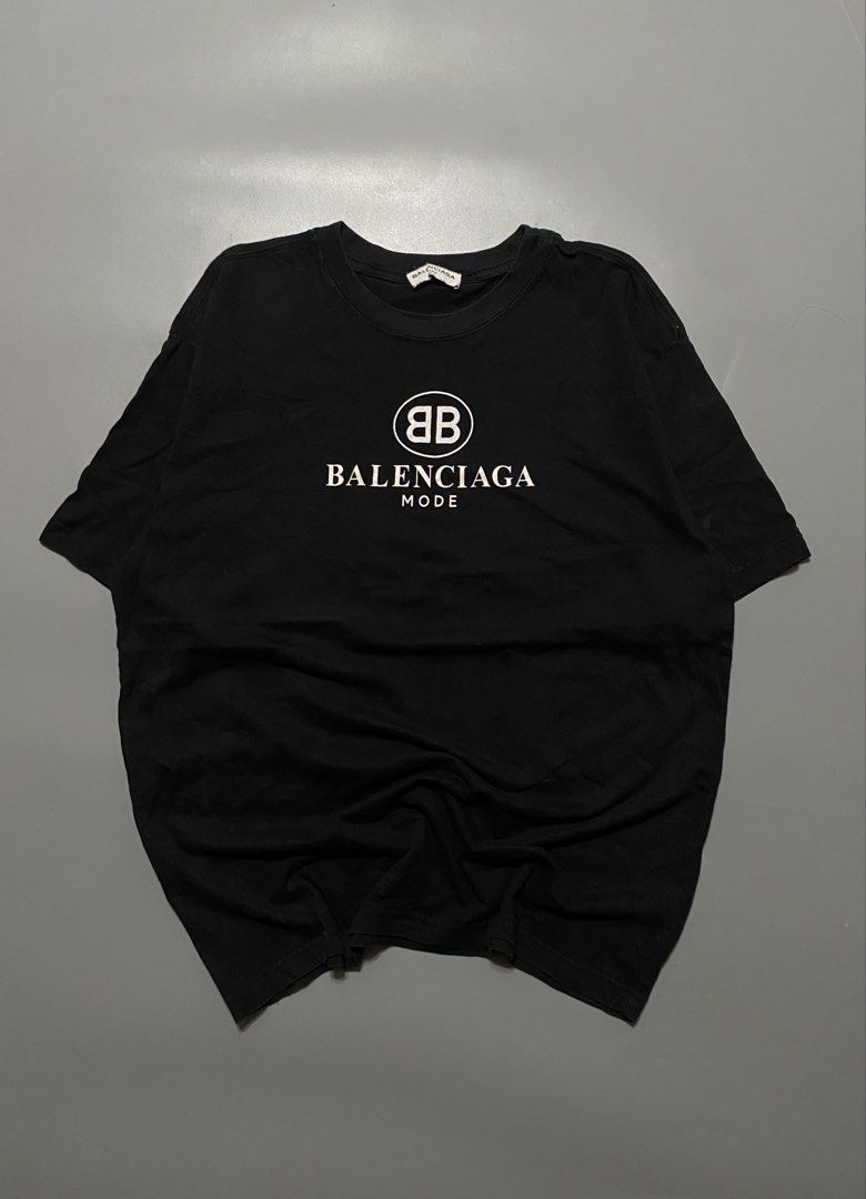 Balenciaga Mode Logo T-Shirt (Category: Tshirts & Polo Shirts ) located in Silang. Submitted by kenneth_ukays (Listing ID 1464577589, Image 1). Description: - Brand: Balenciaga - Style: Mode T-shirt - Color: Black - Size: XS - Features: Iconic BB logo and 'Balenciaga Mode' text - Occasion: Casual wear.