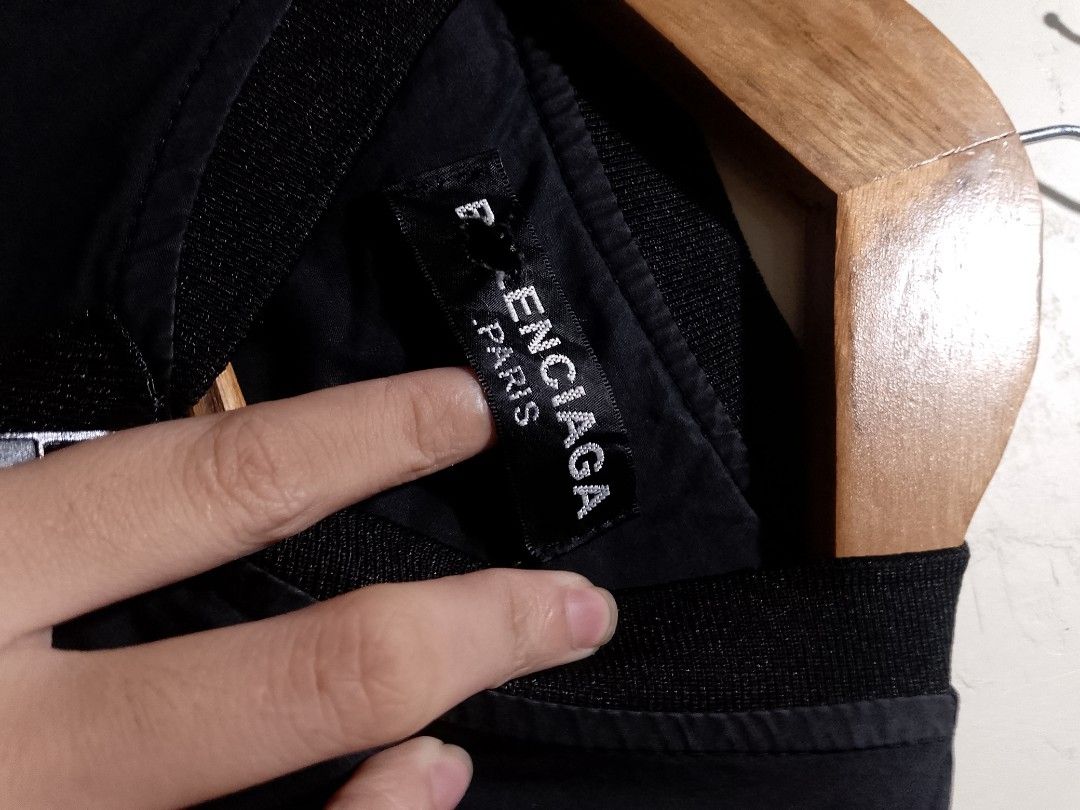 Balenciaga Paris All Over Logo Bomber Jacket (Category: Luxury Apparel) located in Manila. Submitted by bengluxury (Listing ID 1464579353, Image 2). Description: - Authentic Balenciaga jacket - All-over 'Balenciaga Paris' logo print - Made in Portugal - Features a drawstring waist - Long sleeves - Perfect for fashion enthusiasts.