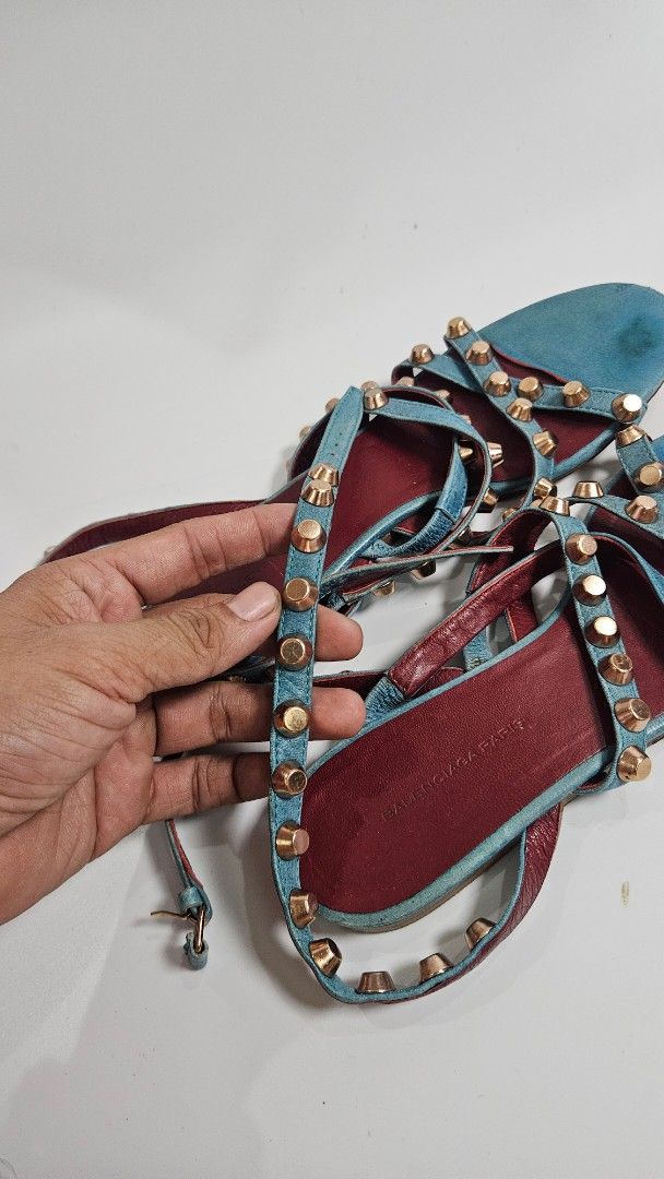 Balenciaga Paris Studded Gladiator Sandals (Category: Sandals) located in Alfonso. Submitted by jbcamet (Listing ID 1464604498, Image 3). Description: - Balenciaga Paris gladiator sandals - Teal blue suede with burgundy leather lining - Gold tone studs all over straps - Straps wrap around the ankle - Statement piece for any outfit - Signs of wear on soles and straps.