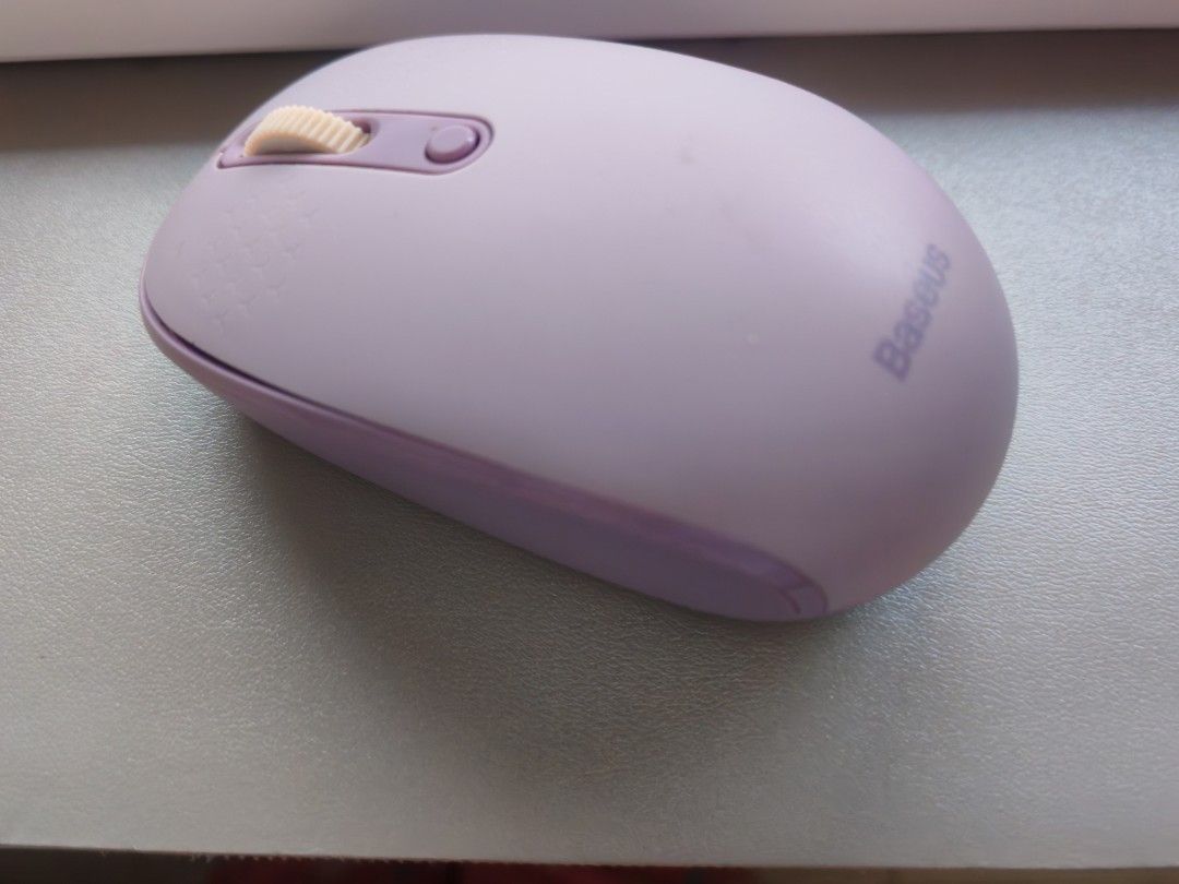 Baseus Purple Wireless 2.4 GHz Bluetooth Mouse (Category: Mouse & Mousepads) located in Dasmarinas. Submitted by titaniumrosegold (Listing ID 1464606965, Image 1). Description: - Baseus Purple Wireless Mouse - Connects via 2.4G or Bluetooth - Features a scroll wheel and two buttons - Reliable performance for everyday tasks - Ideal for computers and laptops rfs: decluttering.