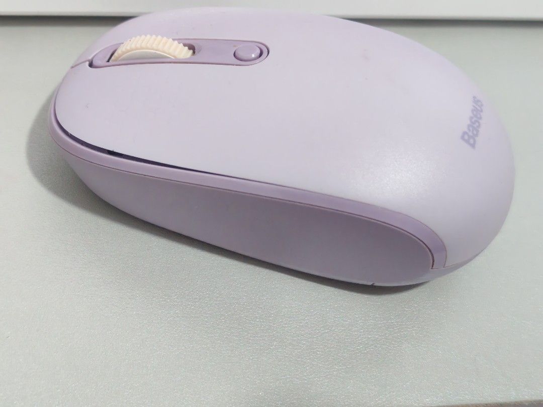 Baseus Purple Wireless 2.4 GHz Bluetooth Mouse (Category: Mouse & Mousepads) located in Dasmarinas. Submitted by titaniumrosegold (Listing ID 1464606965, Image 2). Description: - Baseus Purple Wireless Mouse - Connects via 2.4G or Bluetooth - Features a scroll wheel and two buttons - Reliable performance for everyday tasks - Ideal for computers and laptops rfs: decluttering.