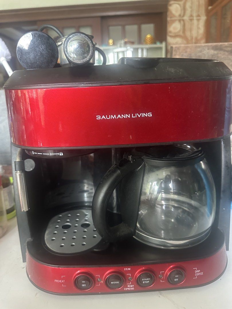 Baumann Living Red Espresso and Drip Coffee Maker (Category: Coffee Machines & Makers) located in Amadeo. Submitted by maricarkim (Listing ID 1464617214, Image 2). Description: - Red Baumann Living coffee maker - Brews both espresso and drip coffee - Features a steam function - Includes glass carafe - Some signs of wear on the exterior.