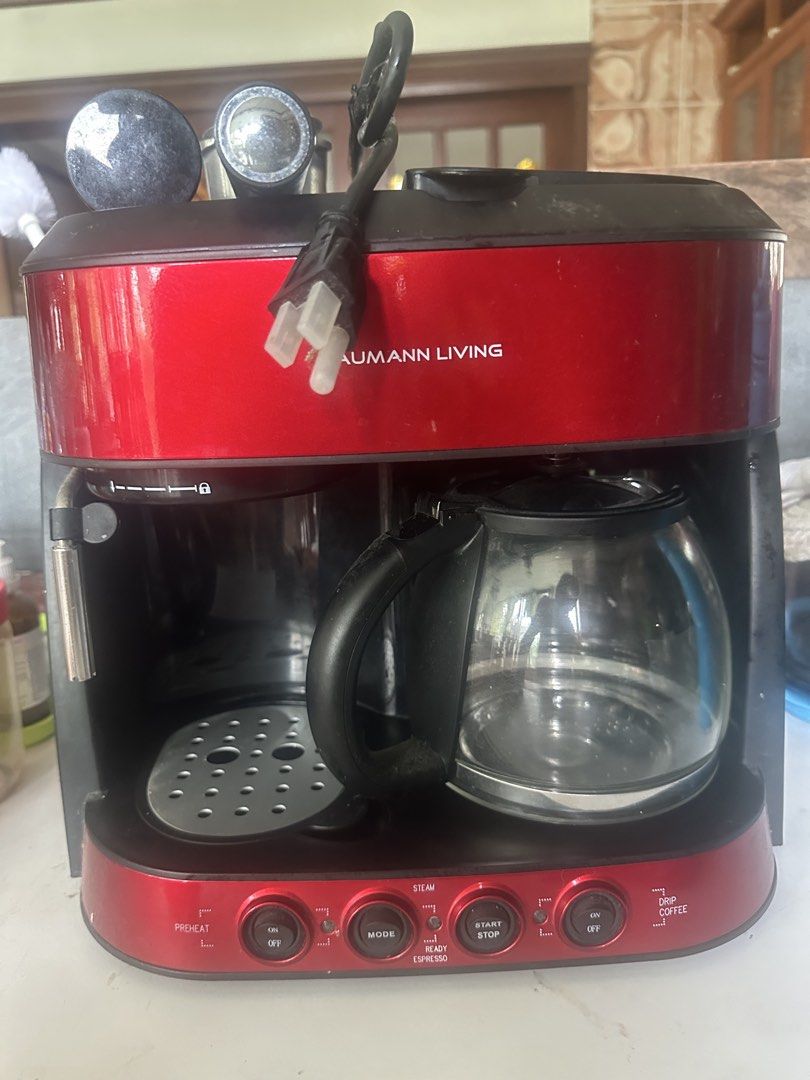 Baumann Living Red Espresso and Drip Coffee Maker (Category: Coffee Machines & Makers) located in Amadeo. Submitted by maricarkim (Listing ID 1464617214, Image 1). Description: - Red Baumann Living coffee maker - Brews both espresso and drip coffee - Features a steam function - Includes glass carafe - Some signs of wear on the exterior.