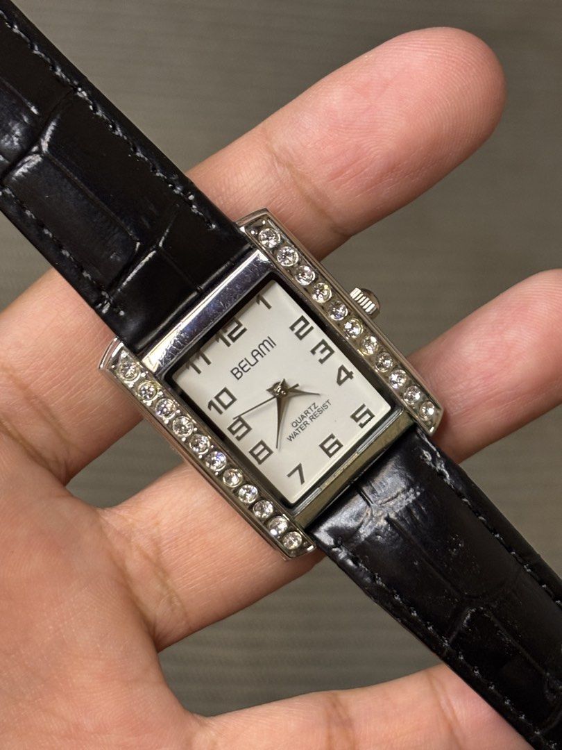 Belami Rhinestone Bezel Silver Tank (Category: Women's Watches) located in Manila. Submitted by soughtafterseconds (Listing ID 1464748948, Image 2). Description: Belami Rhinestone Bezel Silver Tank This Belami Rhinestone Bezel Silver Tank Quartz Watch (Ref. BA-1224) is a striking piece of 1990s Japanese fashion horology, blending Art Deco rectangular geometry with iced-out brancards and stylized typography. Belami was registered in Tokyo, Japan, 