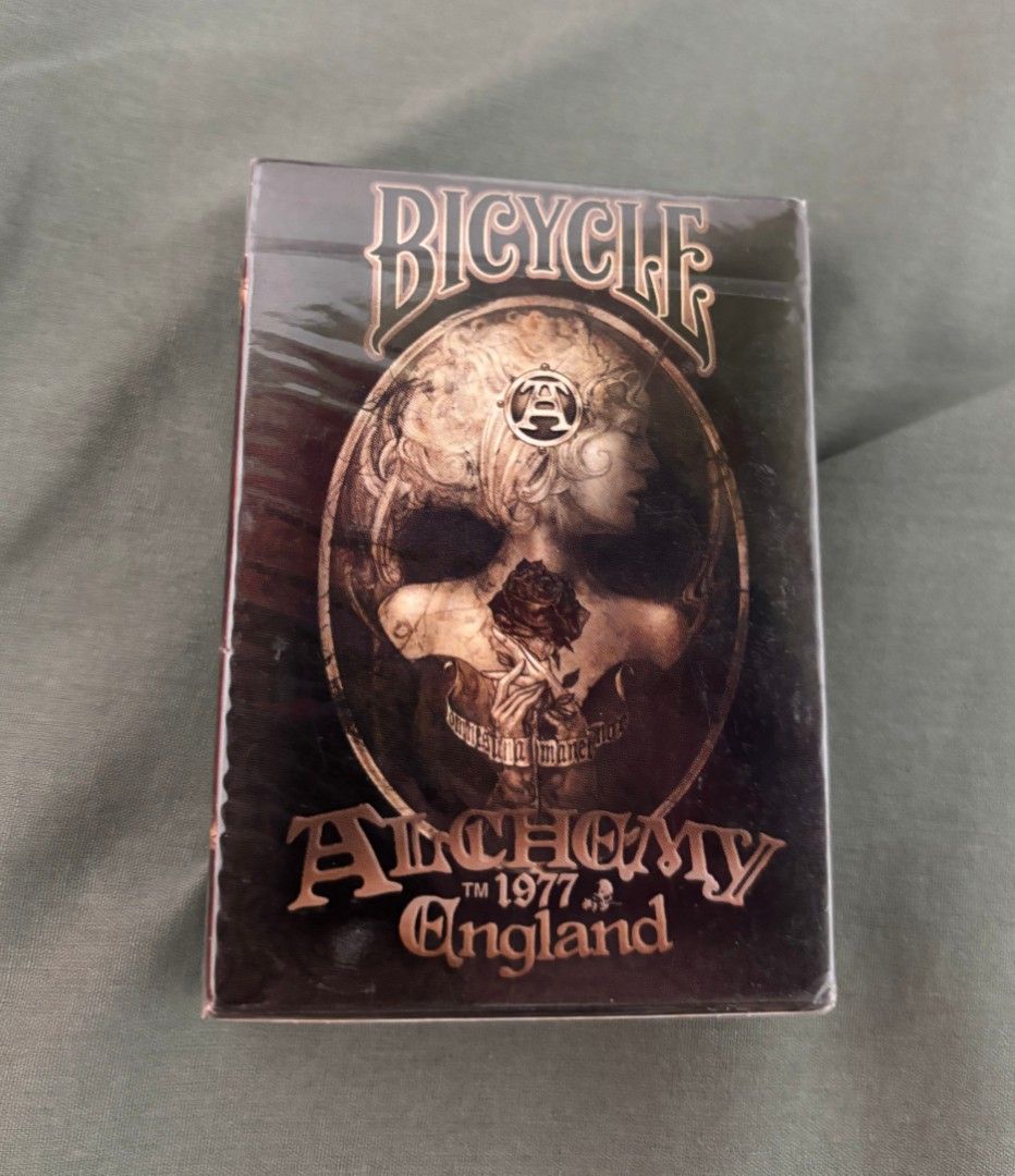 BICYCLE PLAYING CARDS ALCHEMY 1977 ENGLAND (2012) Version 2 (Category: Art & Prints) located in San Pablo. Submitted by macmaiamax (Listing ID 1464727190, Image 1). Description: BICYCLE PLAYING CARDS ALCHEMY 1977 ENGLAND 2012 version 2 Php 1000 + shipping fee J&T delivery Brand new and sealed Authentic and Original Unique Artwork: All 54 cards feature distinct, intricate gothic-themed designs on both the front faces and the back. Visual Themes: S