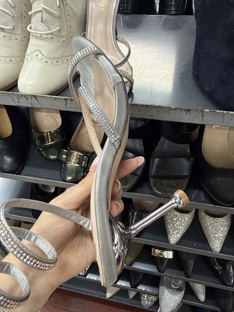 Bigtree Silver Rhinestone Spiral Stiletto Heels (Category: Heels) located in Manila. Submitted by fastlion.584bdf (Listing ID 1464734473, Image 3). Description: - Brand/Model: Bigtree Silver Stiletto Heels - Design: Rhinestone-encrusted wrap-around ankle straps with open toe front - Finish: Metallic silver heels and soles with light beige inner sole - Style: Slip-on wrap style - Occasion: Perfect eye-catching party shoes for events and nights out