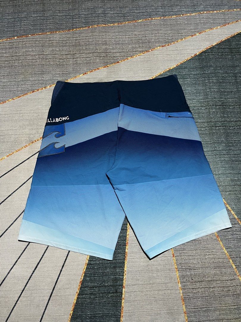 Billabong Board Shorts 34W 2DL Blue Gradient (Category: Swim Trunks & Board Shorts) located in Puerto Princesa. Submitted by dijaydj28 (Listing ID 1464589913, Image 3). Description: - Brand: Billabong - Size: 34 - Design: Cool blue gradient - Features: Drawstring waistband for a secure fit - Pocket: One back pocket - Ideal for: Swimming, surfing, and all water activities.