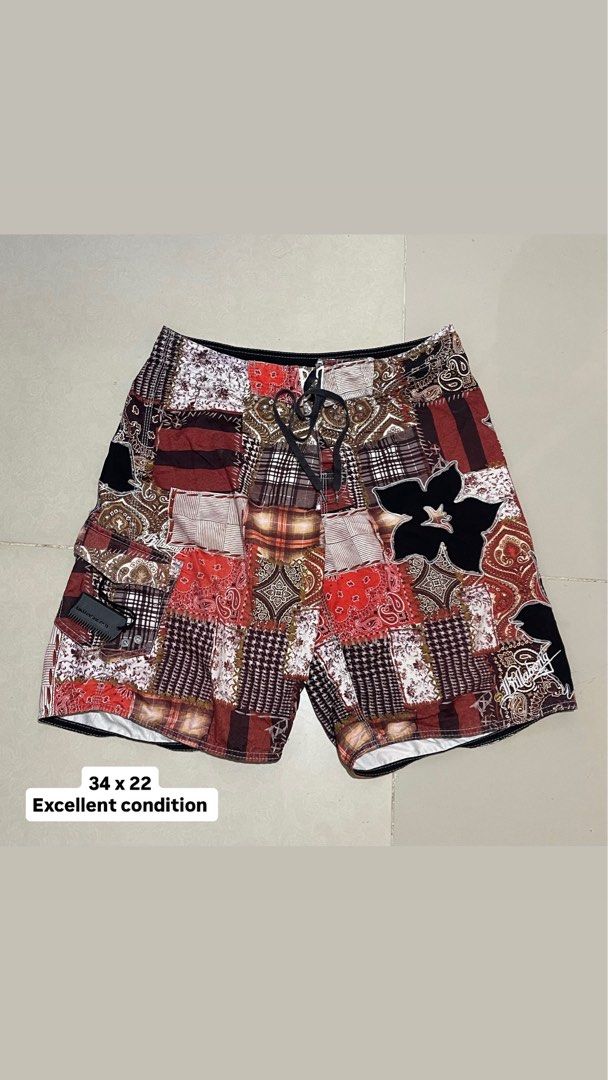Billabong Patchwork Floral Board Shorts Swim Trunks 34 (Category: Swim Trunks & Board Shorts) located in Manila. Submitted by micoletszx81430 (Listing ID 1464700294, Image 1). Description: - Brand: Billabong - Style: Patchwork board shorts with mixed paisley, plaid, and floral hibiscus appliques - Colorway: Red, white, black, and brown - Features: Drawstring waistband with black laces and side cargo pocket with branded pull tab - Measurements: 34