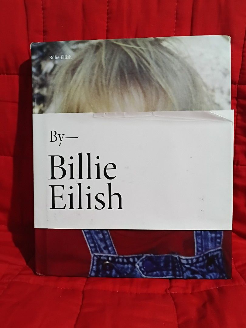 Billie Eilish Official Photo Book (Category: Magazines) located in Manila. Submitted by krishna_ayanami (Listing ID 1464737988, Image 1). Description: - Official Billie Eilish photo book published by Grand Central Publishing - Hardcover edition with large format, full-color pages - Features hundreds of candid personal photos from childhood to early music career - Perfect collector's piece for fans - Condition: Clean pages with minimal shelf wear 
