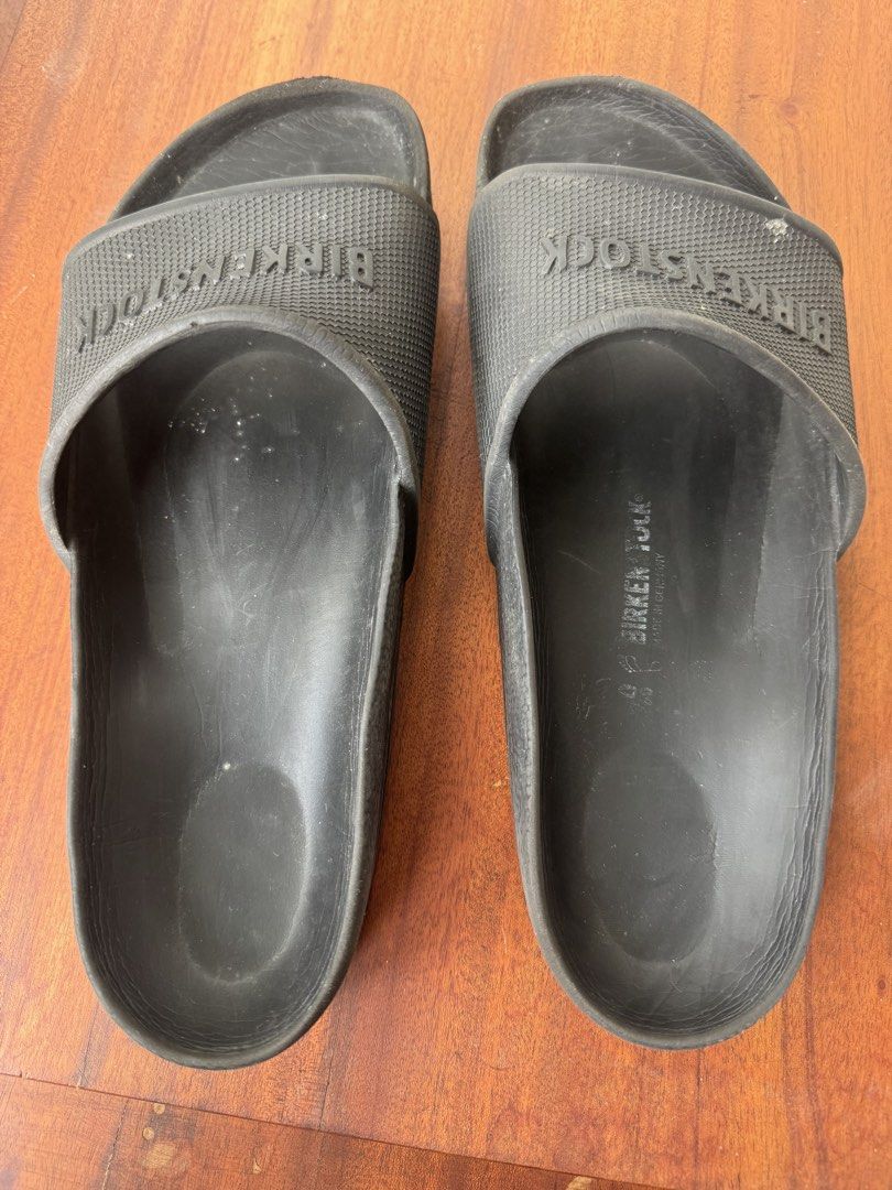 Birkenstock Black Rubber Slides Size 42 (Category: Slippers & Slides) located in Manila. Submitted by xenasales (Listing ID 1464603129, Image 1). Description: - Black Birkenstock slides - Rubber material - Size 40 - Soles show some wear - Perfect for casual wear or after sports - Easy to clean.