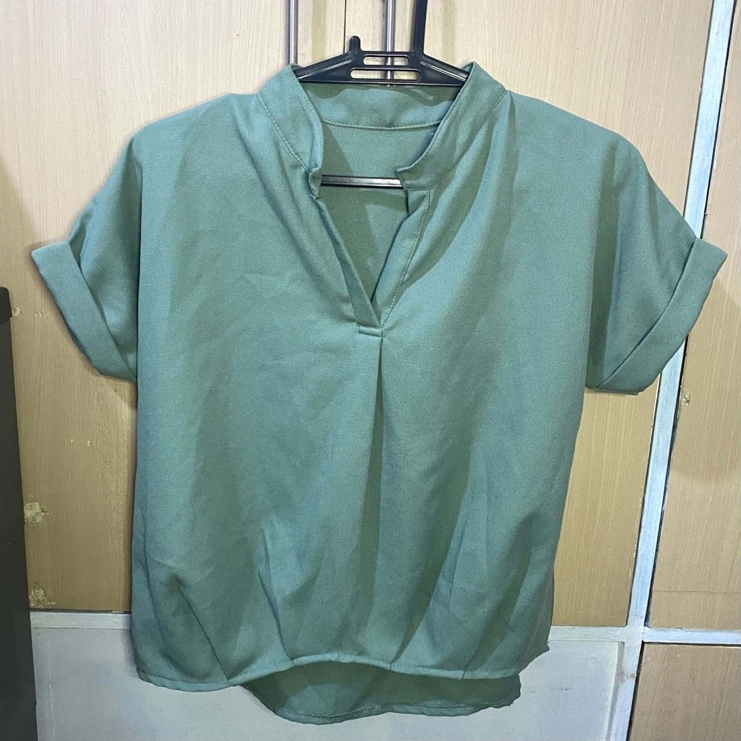 Bkk Blouse in Green (Category: Blouses) located in Las Pinas. Submitted by modemnl (Listing ID 1464733339, Image 1). Description: Size: Freesize (fits up to Large) | Color: Green Simple and versatile plain green blouse that’s perfect for everyday wear, casual outings, or dressed-up looks. -Lightweight and comfortable -Relaxed, easy-to-wear fit -Classic plain design -Easy to pair with jeans, trousers, or skirts.