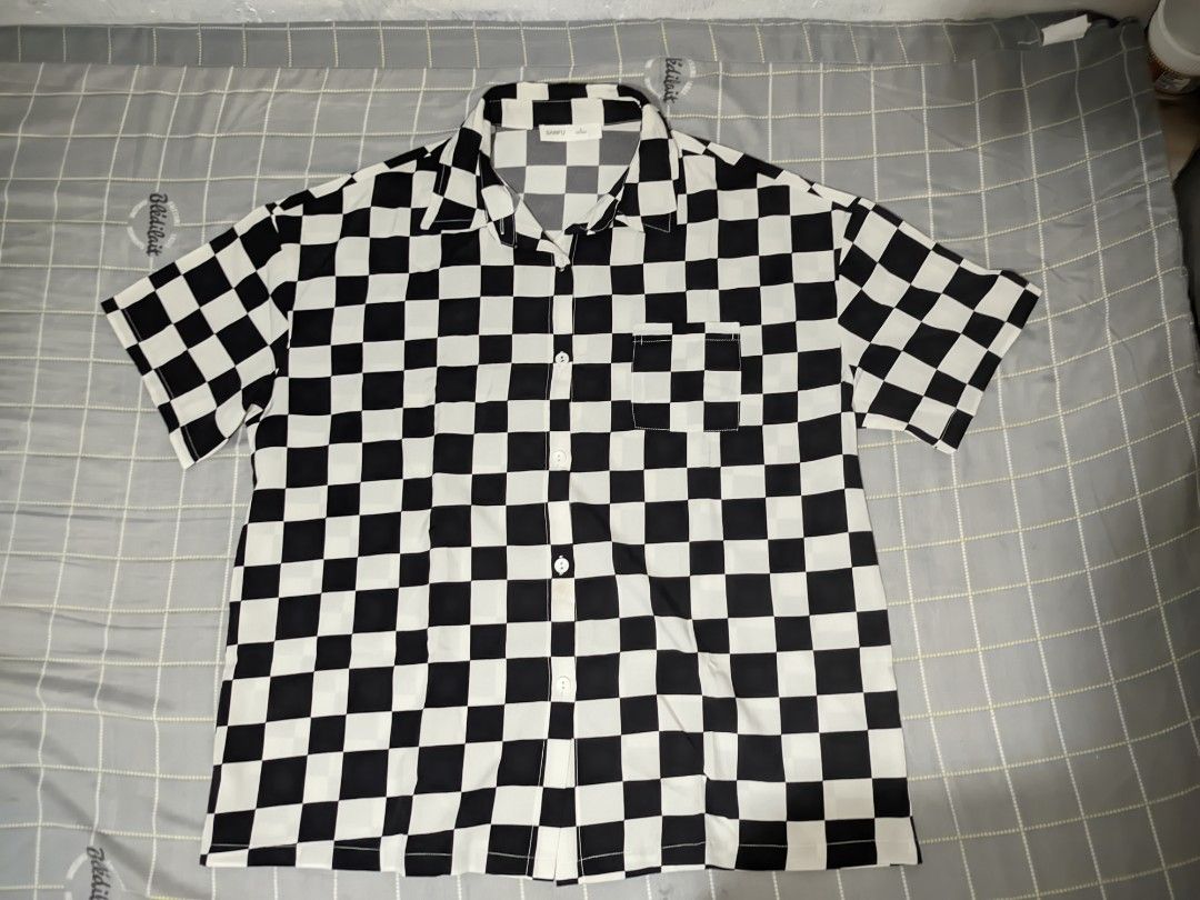 Black & White Checkered Polo Shirt (Category: Tshirts & Polo Shirts ) located in Catarman. Submitted by closet.connect (Listing ID 1464734965, Image 2). Description: The item is too big for the user, but still works just fine specially for oversized lovers.