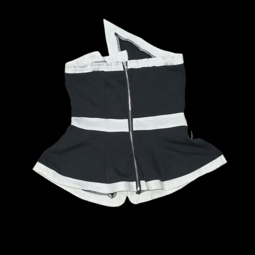 Black and White Asymmetrical Strapless Top with Bow (Category: Sleeveless) located in Cabiao. Submitted by isaroraa (Listing ID 1464748934, Image 2). Description: - Color: Black and white - Style: Strapless top with asymmetrical folded collar - Details: Cute white bow on the front waistline - Trim: Contrast white piping along the top edge, front opening, and flared hem - Closure: Full zipper closure down the back - Fit: Stretchy elastic panel acr