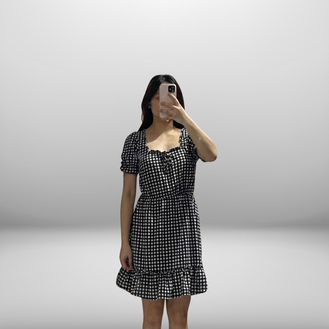 Black and white gingham ruffled mini dress (Category: Dresses) located in Angeles City. Submitted by slay.the.day (Listing ID 1464720399, Image 1). Description: - Trendy black and white checkered pattern - Flattering square neckline with a cute tie detail - Stylish puff sleeves and comfortable elastic waist - Playful ruffle hemline sitting above the knee - Lightweight fabric, perfect for easy everyday wear - USED ONLY ONCE.