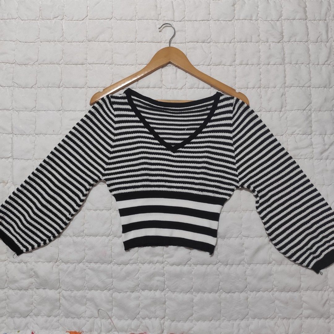 Black and White Striped V-Neck Knit Top (Category: Longsleeves) located in Bacolod City. Submitted by dearicawho.56 (Listing ID 1464709396, Image 1). Description: - Color & Pattern: Classic black and white stripes with thicker stripes near the hem - Design: Flattering V-neckline and trendy wide bell sleeves - Fit: Modern cropped length - Material: Soft and cozy textured knit fabric - Size: Can fit Small- Medium 🧾Mode of payment: 💙Gcash 💚GoTyme