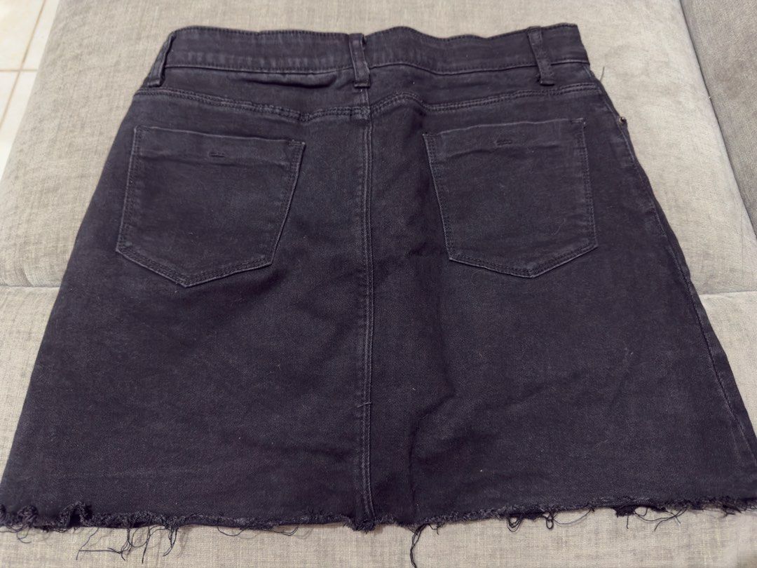 Black Denim Skirt Raw Hem (Category: Skirts) located in Taguig. Submitted by marietimebiscuit (Listing ID 1464725669, Image 2). Description: Black denim skirt with a raw distressed hem. High-waisted style with front and back pockets, belt loops, and a button fly closure. Classic dark wash versatile piece. Great wardrobe basic that pairs easily with tees and boots..
