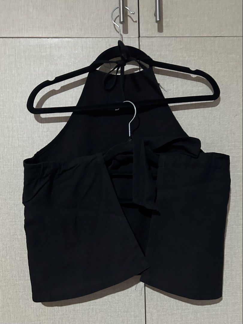 Black Halter-Backless Top with Tie Back (Category: Sleeveless) located in Pasig City. Submitted by winwinderland (Listing ID 1464620567, Image 2). Description: Black Halter-Backless Top with Tie Back — ₱80 + SF ✱ Small ✱ used only 2 times ✱ black colorway ✱ in good condition ✱ tie closure ✱ bought from Tiktok Shop.