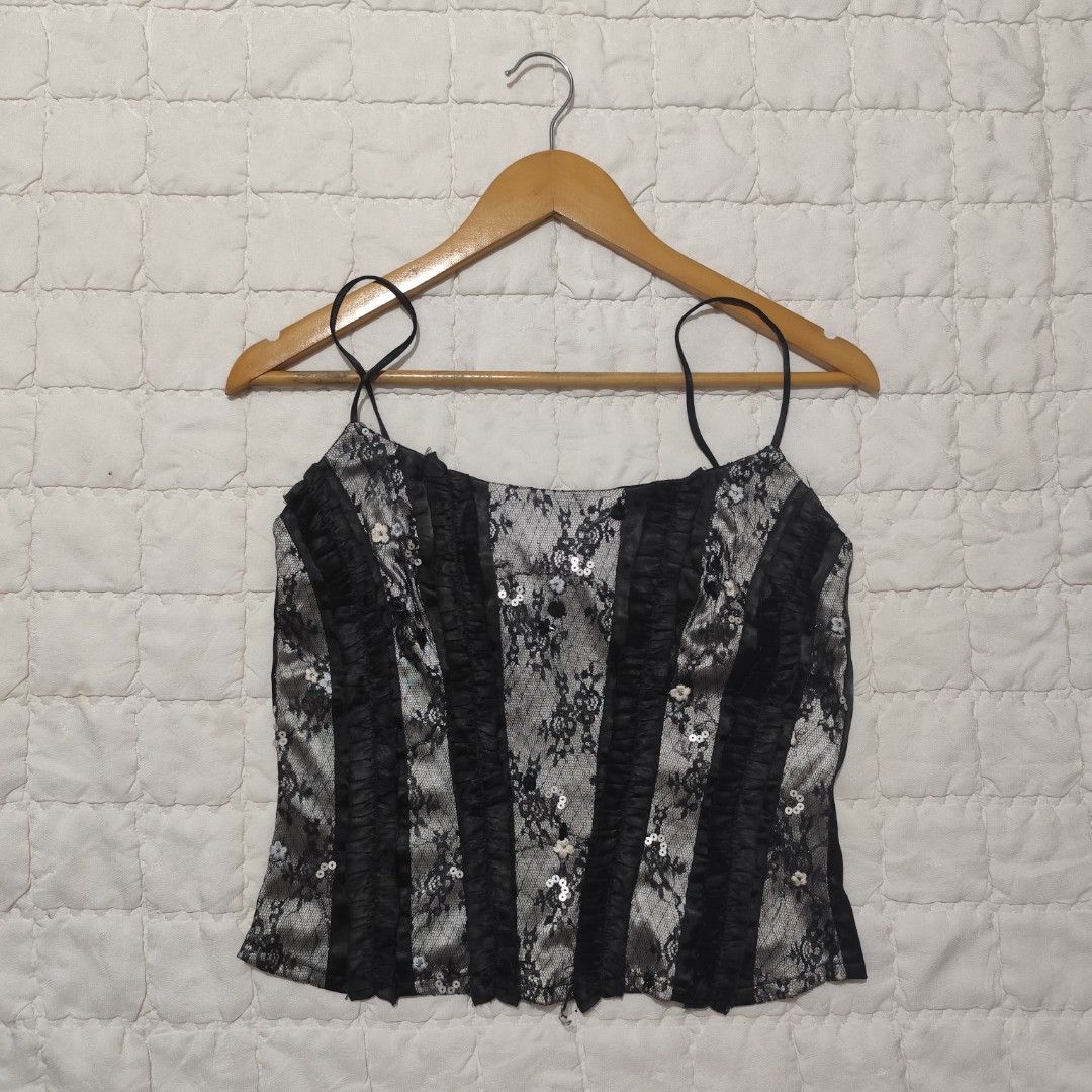 Black lace corset style cami top (Category: Sleeveless) located in Bacolod City. Submitted by dearicawho.56 (Listing ID 1464711946, Image 1). Description: - Black and silver lace cami top - Structured vertical satin ruffles on the front - Thin spaghetti straps - Full-length zipper closure at the back - Ultimate Y2K aesthetic style for going out 🧾Mode of payment: 💙Gcash 💚GoTyme 🖤Maya 📍 Bacolod City. Negros Occidental .
