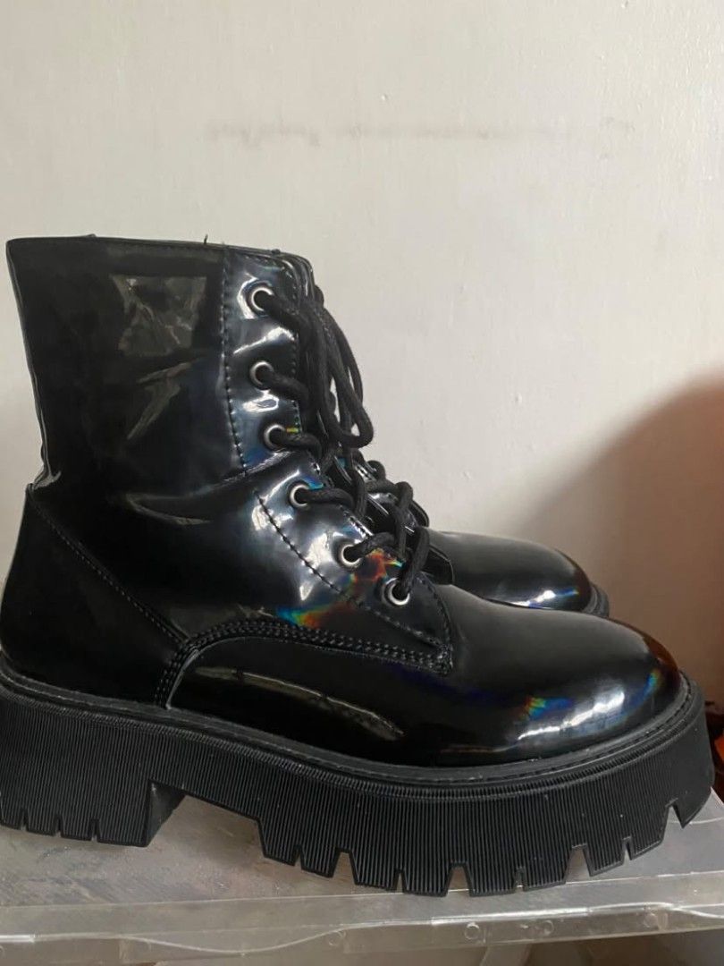 Black Patent Chunky Platform Combat Boots (Category: Boots) located in Paranaque City. Submitted by mikastylechik.co (Listing ID 1464602843, Image 3). Description: Bershka black patent combat boots, size 36. Features a chunky platform lug sole, lace-up front, and side zipper. Cool holographic sheen. Perfect for daily wear or styling up..