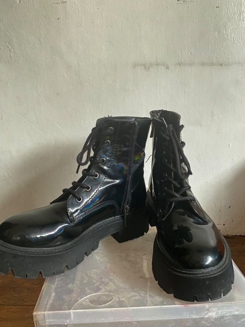 Black Patent Chunky Platform Combat Boots (Category: Boots) located in Paranaque City. Submitted by mikastylechik.co (Listing ID 1464602843, Image 2). Description: Bershka black patent combat boots, size 36. Features a chunky platform lug sole, lace-up front, and side zipper. Cool holographic sheen. Perfect for daily wear or styling up..