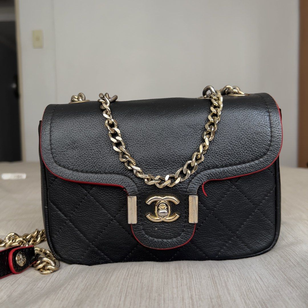 Black Quilted Leather Chain Bag with Red Trim (Category: Shoulder Bags) located in Pasig City. Submitted by jenscloset86 (Listing ID 1464668064, Image 3). Description: Measurement: Length: 8.5” Height: 6” Bottom width: 2.5” Strap: 40.5” • Soft and smooth leather • With visible damages (see photos for reference) •Cracking and detached red paint edges. • Need stitching in the lining. .