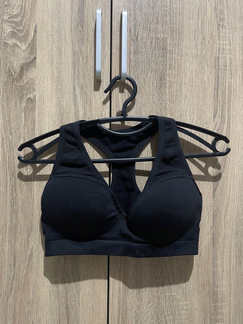 Black Racerback Sports Bra (Category: Activewear) located in Manila. Submitted by preloveditems_jem (Listing ID 1464663813, Image 1). Description: Black sports bra with a racerback design. Seamless construction for comfort. Mesh detailing on the straps and back. Good support for workouts. Suitable for various activities..