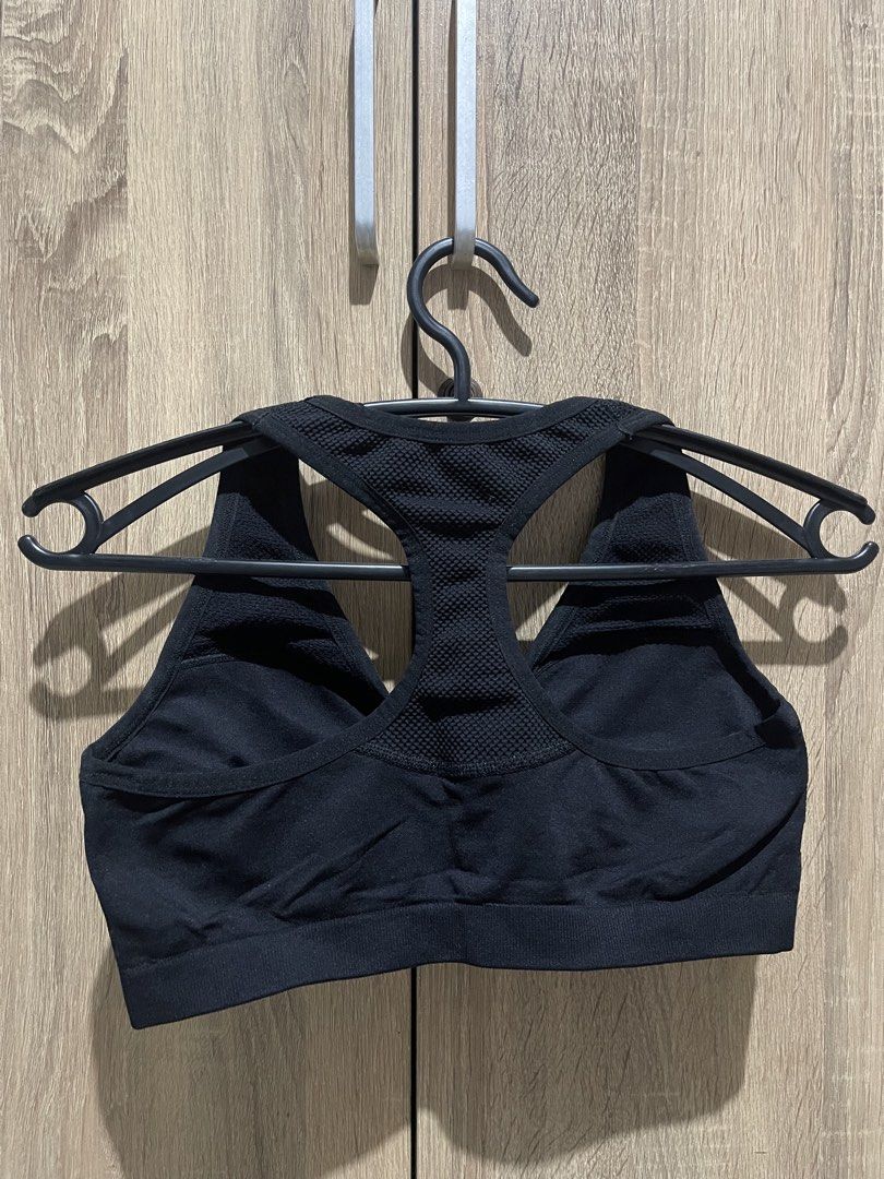 Black Racerback Sports Bra (Category: Activewear) located in Manila. Submitted by preloveditems_jem (Listing ID 1464663813, Image 3). Description: Black sports bra with a racerback design. Seamless construction for comfort. Mesh detailing on the straps and back. Good support for workouts. Suitable for various activities..