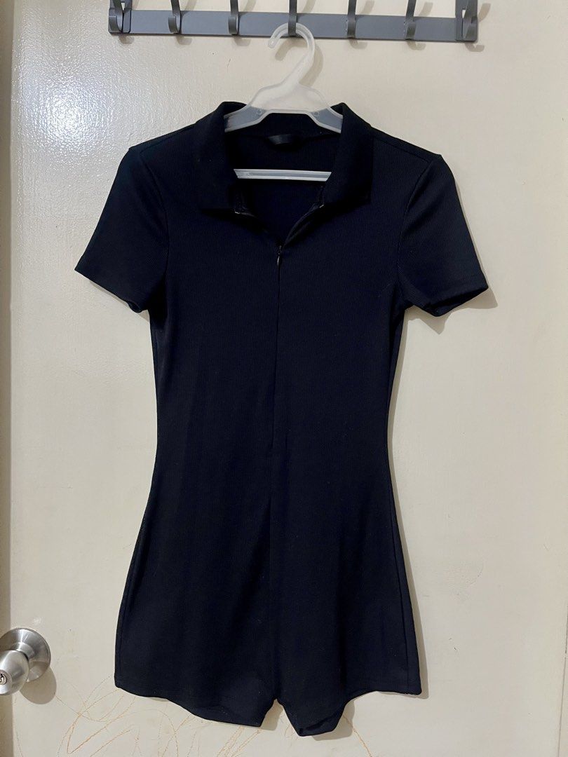 Black Ribbed Collar Zip Front Romper (Category: Rompers) located in Manila. Submitted by outtacloset (Listing ID 1464713468, Image 1). Description: - Color: Black - Style: Ribbed knit romper with built-in shorts and form-fitting silhouette - Features: Short sleeves, stylish collared neckline, and adjustable front zipper closure - Comfort: Super stretchy and comfortable fabric - Best for: Casual outings, daily errands, or effortless everyday styli