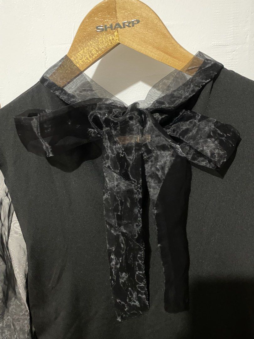 Black Sheer Sleeve Bow Blouse (Category: Blouses) located in Manila. Submitted by zapitup (Listing ID 1464570731, Image 2). Description: - Stylish black top - Features a cute ribbon tie at the neck - Sheer puff sleeves with elastic cuffs - Perfect for dressing up or down - Easily pairs with skirts or pants.