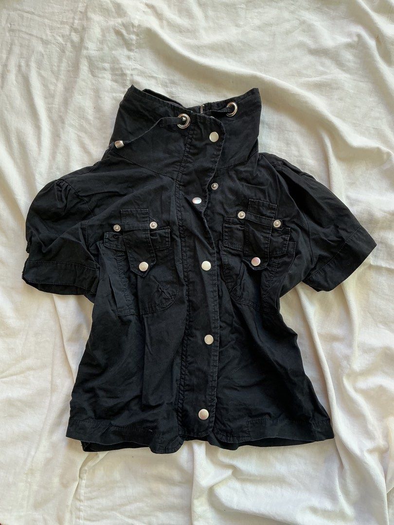 Black Short Sleeve Jacket with High Collar (Category: Coats, Jackets and Outerwear) located in San Nicolas. Submitted by dijie.cam (Listing ID 1464641218, Image 1). Description: - Black short sleeve jacket - High collar with drawstring detail - Silver snap button closures on collar and chest pockets - Zipper front closure - Two chest pockets - Unique, edgy style - Ideal for layering.