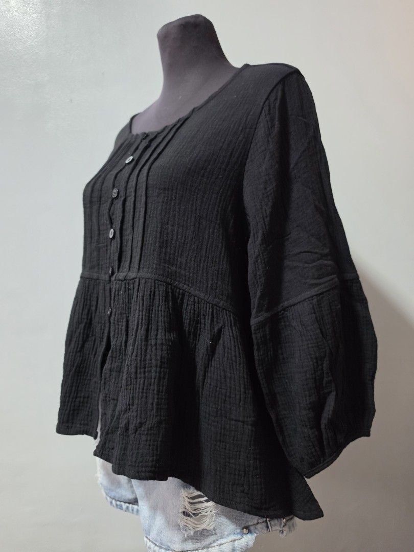 Black Textured Button-Up Long Sleeve Blouse large (Category: Longsleeves) located in Paranaque City. Submitted by franinnashop (Listing ID 1464637145, Image 2). Description: - Black long-sleeved blouse - Textured, crinkled fabric - Button-up front with small black buttons - Rounded scoop neckline - Versatile: pairs well with jeans or skirts - Comfortable and stylish for everyday wear declutter large to xl paranque city.