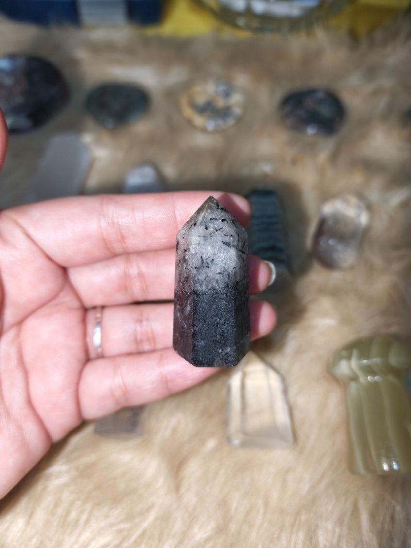 Black Tourmalinated Quartz Mini Tower (Category: Precious Stones) located in Quezon City. Submitted by piaoliangcollections.ph (Listing ID 1464736643, Image 1). Description: Black tourmaline quartz (also called tourmalinated quartz) combines the grounding protection of black tourmaline with the amplifying energy of clear quartz. Core Benefits Energy Shielding: Deflects negative energy and forms a protective barrier against external stress or psyc