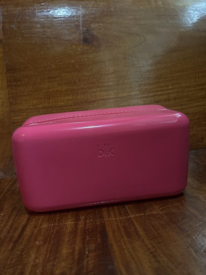 BLK Cosmetics Glossy Pouch (Category: Purses & Pouches) located in Manila. Submitted by declutter.diaries (Listing ID 1464577779, Image 3). Description: - pink cosmetics gloss pouch from BLK - Rectangular shape with zipper closure - Ideal for organizing makeup and toiletries - Easy-to-clean material - Compact size, perfect for travel or everyday use - Never used, only stuck at home.