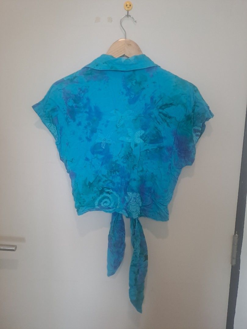 Blouse cover up (Category: Undergarments & Loungewear) located in Manila. Submitted by joanbalde39643 (Listing ID 1464664019, Image 3). Description: This vibrant teal and blue tie-front crop shirt features a distinct bohemiam bohemian-style wax-resist batik dye pattern with ornate floral and circular lace-like stamping throughout the fabric.PoshmarkBodacious Resortwear | Tops | Vintage Bodacious Resortwear ...eBay UK90s Vintage Blue Ombre Floral 