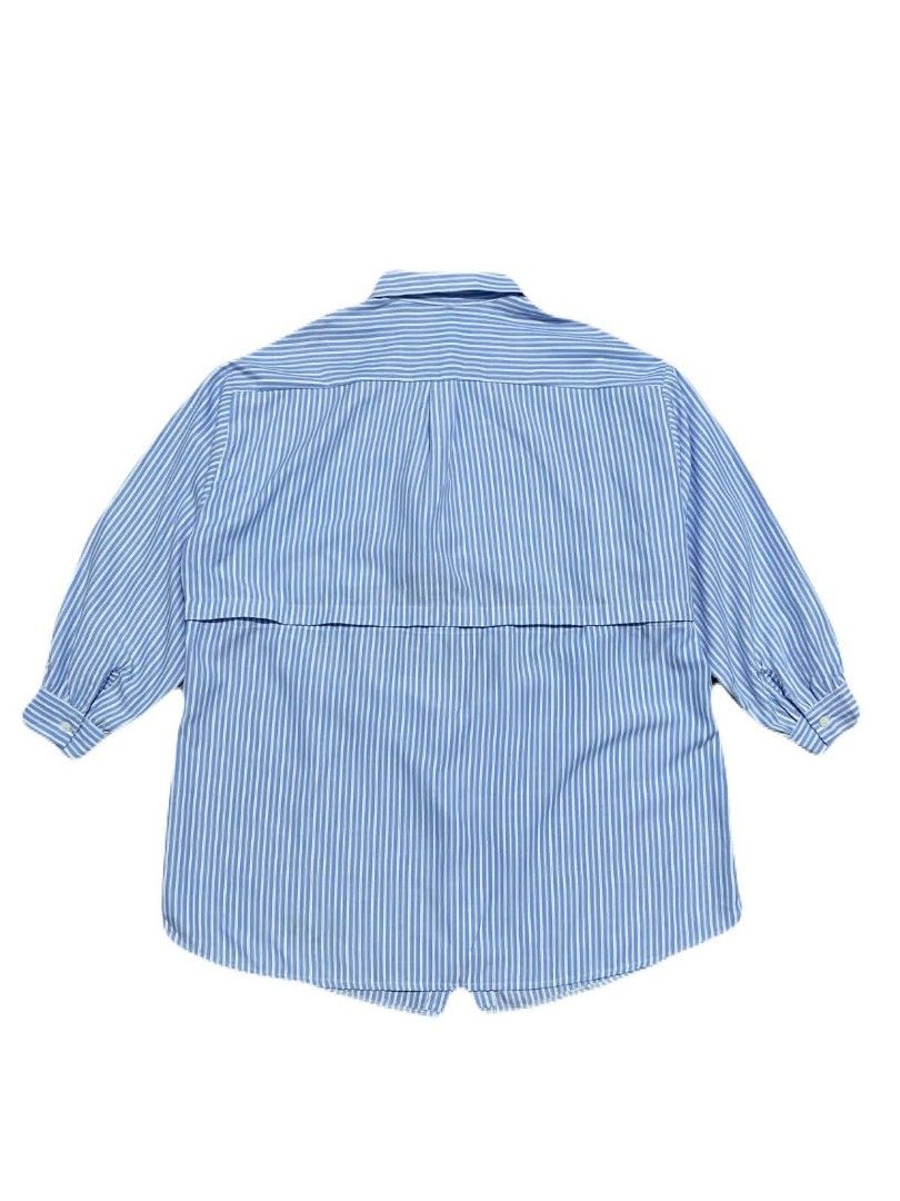 Blue and White Striped Layered Shirt (Category: Shirts) located in Manila. Submitted by jc.dingz1024 (Listing ID 1464687612, Image 2). Description: - Color/Pattern: Blue and white stripes - Design: Unique layered look with matching buttons - Features: Button-up front, classic collar, and long sleeves - Fit: Relaxed fit for all-day comfort - Style: Versatile piece, perfect for daily outfits.