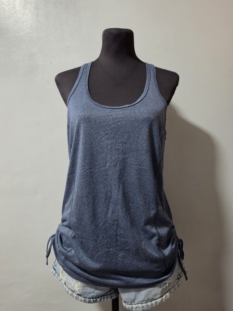 Blue Heathered Tank Top with Drawstring Sides large (Category: Sleeveless) located in Paranaque City. Submitted by franinnashop (Listing ID 1464630943, Image 1). Description: - Blue heathered tank top - Racerback style - Adjustable drawstring ties on both sides to cinch the waist - Fabric has a slight sheen - Great for workouts or casual wear - Comfortable and breathable declutter large paranaque .
