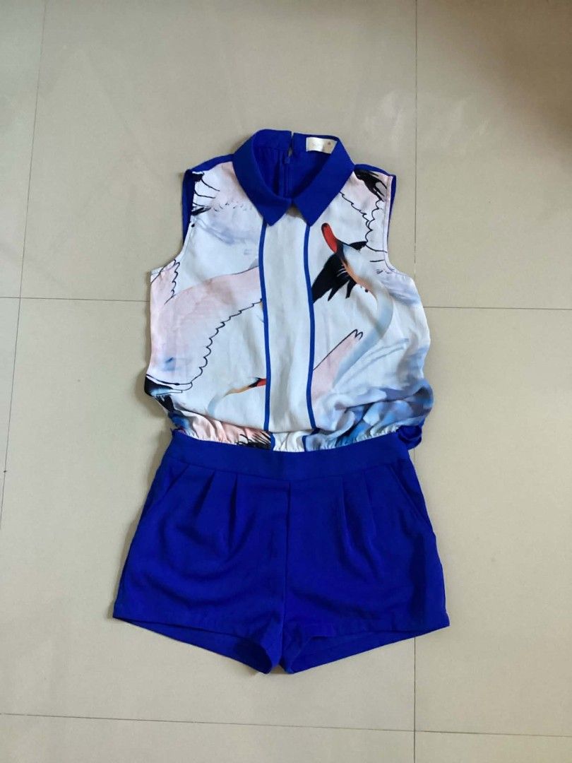 Blue Royal Playsuit with Crane Print Top (Category: Rompers) located in Siniloan. Submitted by mari_881709 (Listing ID 1464616331, Image 1). Description: - Adorable blue romper - Collared, sleeveless top with a charming crane print - Comfortable elasticated waist - Vibrant royal blue shorts - Ideal for casual outings or vacation wear - Easy to wear and stylish.