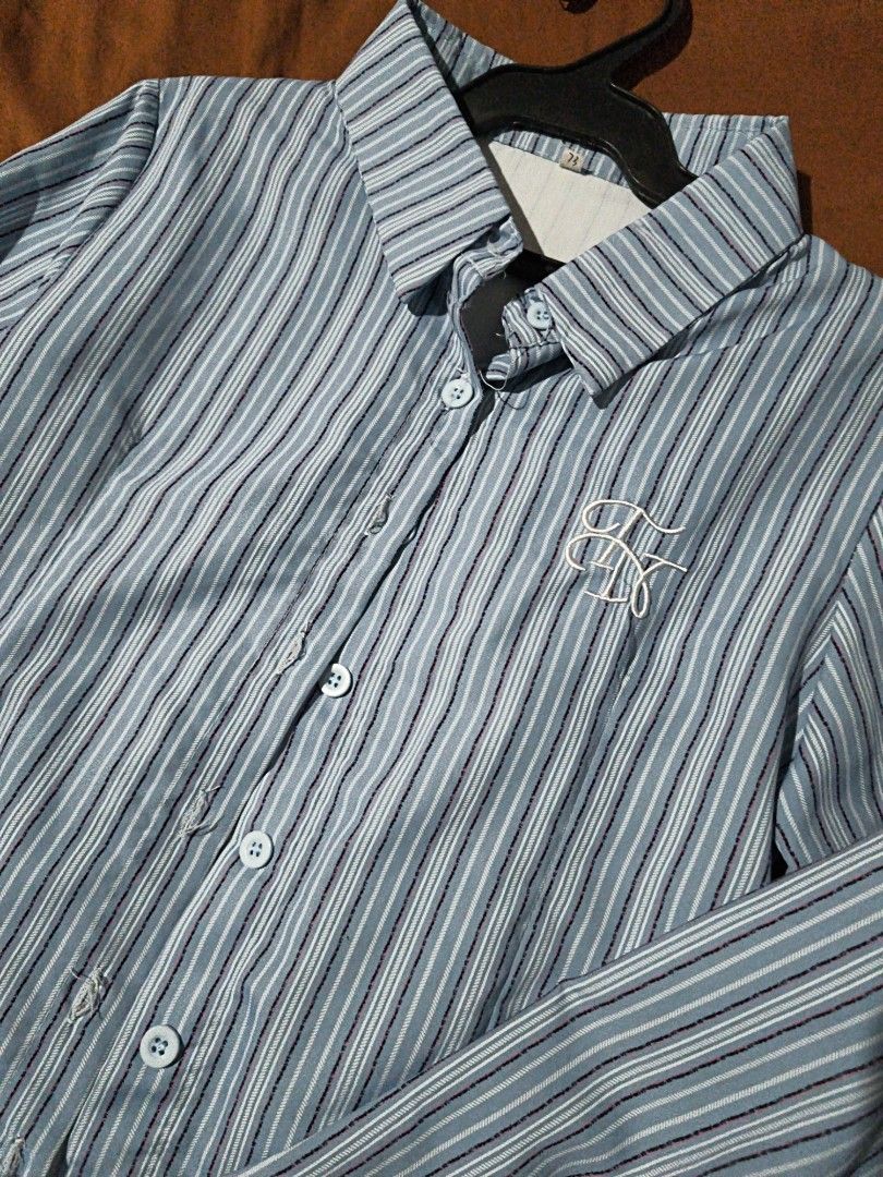 Blue Striped Button-Down Long Sleeve Shirt (Category: Longsleeves) located in Manila. Submitted by xoesnup1 (Listing ID 1464742669, Image 3). Description: Pre loved Price negotiable Fabric: Lightweight and clean stitching.