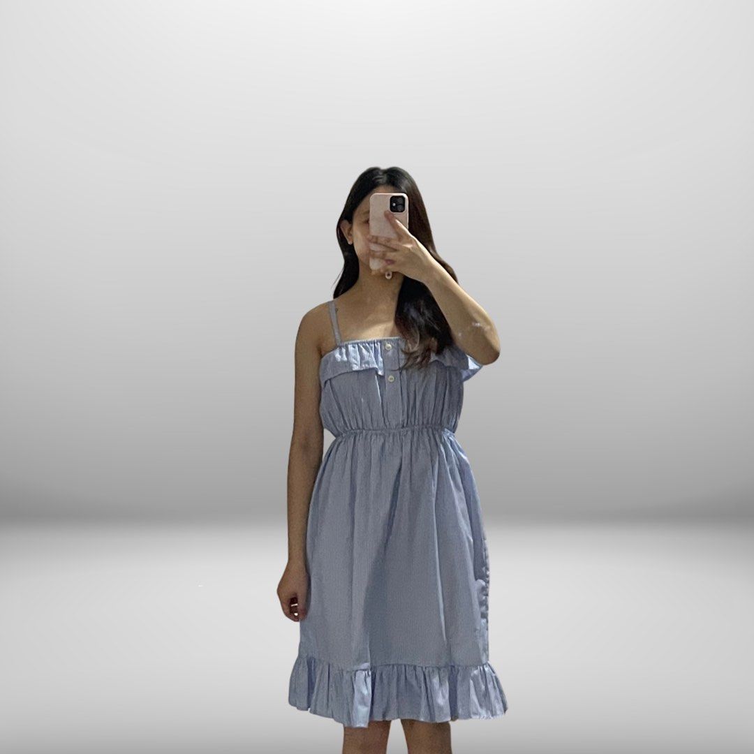 Blue striped spaghetti strap ruffle hem dress (Category: Dresses) located in Angeles City. Submitted by slay.the.day (Listing ID 1464721308, Image 1). Description: - Color/Pattern: Light blue striped - Design: Spaghetti straps with front button accents - Details: Cute ruffles on top bust and bottom hem - Fit: Stretchy cinched waist, knee-length - Vibe: Super comfy and casual, perfect for sunny days.