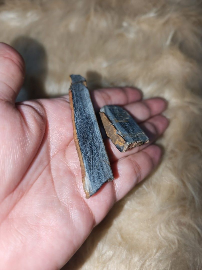 Blue Tiger Eye Raw Natural Crystal (Category: Precious Stones) located in Quezon City. Submitted by piaoliangcollections.ph (Listing ID 1464673897, Image 2). Description: Bundle price for 2pcs. This is Natural Blue Tiger Eye Stone. Blue Tiger's Eye (also called hawk's eye or falcon's eye) is a calming crystal known for reducing stress, improving communication, and boosting intuition. [1, Mental and Emotional Benefits Stress relief: The soothing b