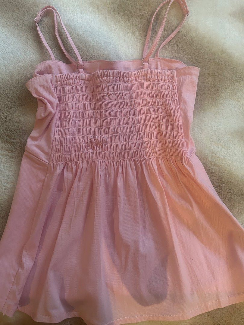 Blush Peplum Camisole Top (Category: Sleeveless) located in Manila. Submitted by __nicscloset (Listing ID 1464691276, Image 2). Description: Size Xs-S Blush color Square neckline with thin adjustable straps Fully smocked, stretchy elastic back for easy wear .