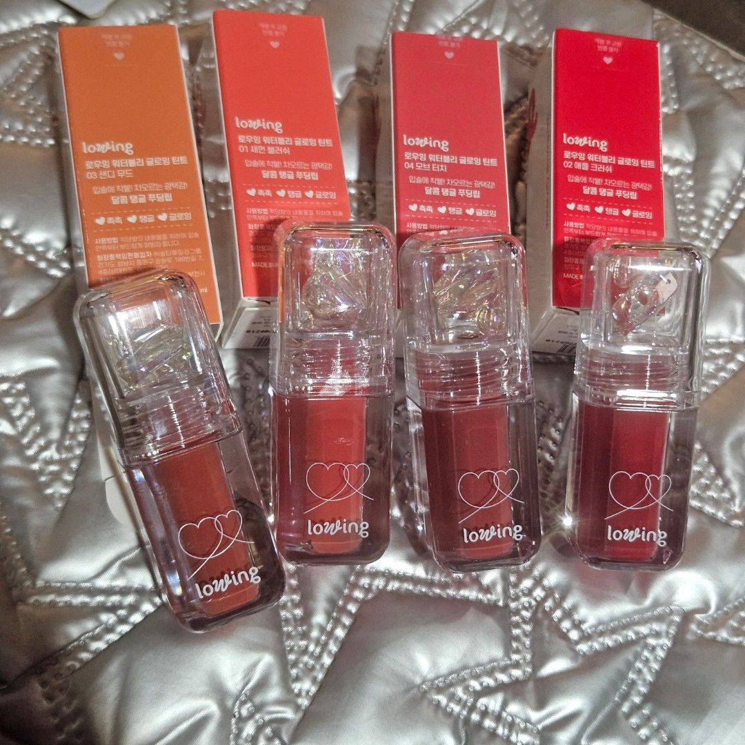 BNew lowing Waterly Glowing Tint (Category: Makeup) located in Manila. Submitted by smartluxeph (Listing ID 1464577742, Image 3). Description: 💗 TINT COLLECTION, SOLVED! 💗 Four wearable shades of lowing Waterly Glowing Tint—with a glossy, juicy finish and the cutest floating heart charm in every cap. ✨ 🍑 01 Salmon Blush 🍎 02 Apple Crush 🤎 03 Sandy Mood 🌹 04 Mauve Touch 🇰🇷 Made in Korea 📦 Brand-new and unused 📅 Expiry: September 2027 💄 