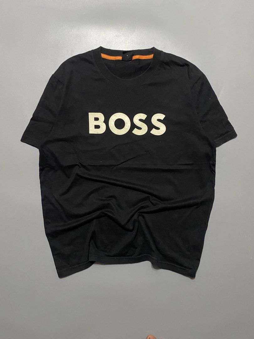 BOSS Black T-Shirt with White Logo (Category: Tshirts & Polo Shirts ) located in Silang. Submitted by kenneth_ukays (Listing ID 1464577509, Image 1). Description: - Classic black t-shirt from BOSS - Iconic white BOSS logo printed across the chest - Comfortable and stylish for everyday wear - Tagged size Medium (M) - Unique orange accent on the inner collar.
