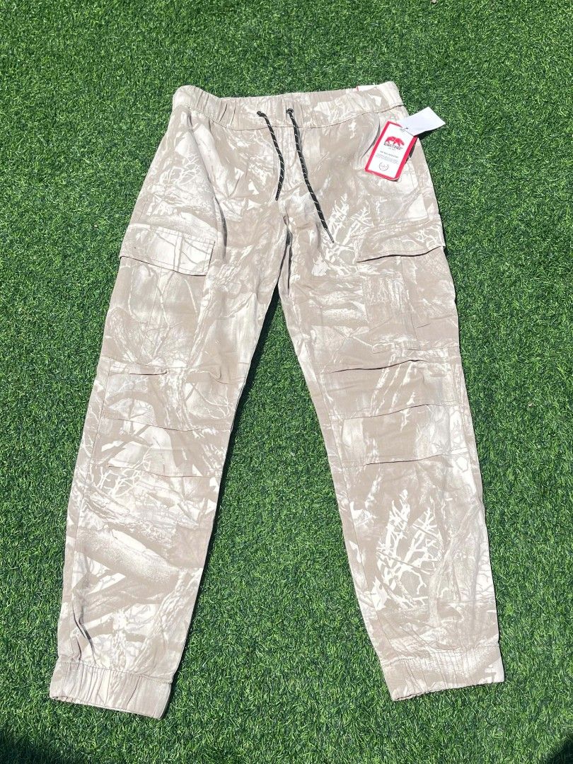 Brand New Camo Cargo Jogger Pants (Category: Joggers) located in Imus. Submitted by warmgem.a59c42 (Listing ID 1464659825, Image 2). Description: - Super cool camouflage cargo pants - Elastic waistband with adjustable drawstring - Jogger style with cuffed ankles - Multiple pockets for ample storage - Brand new with tags still attached - Ideal for casual everyday wear around P2,700 pesos .