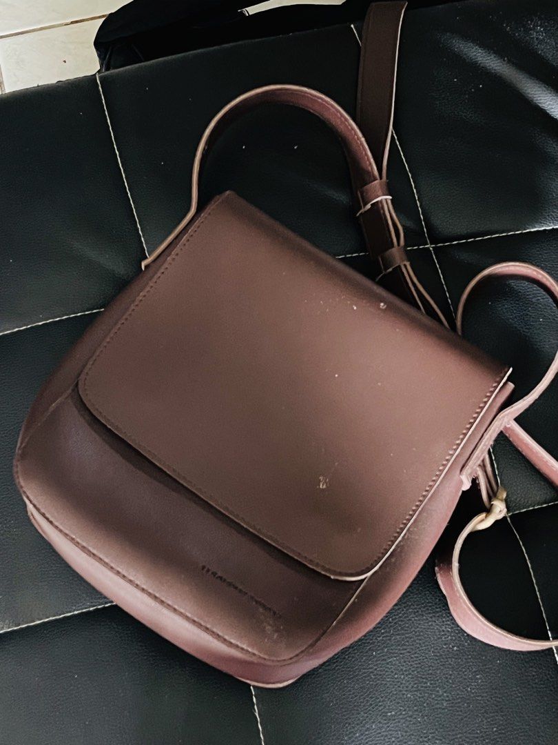 Brown Leather Crossbody Bag (Category: Cross-body Bags) located in Malolos. Submitted by magnoannchrstn (Listing ID 1464617648, Image 1). Description: - Genuine brown leather crossbody bag - Secure flap closure - Adjustable strap for comfortable wear - Minor scuffs on the exterior, consistent with normal use - Immaculate interior lining - Ideal for everyday errands and outings.