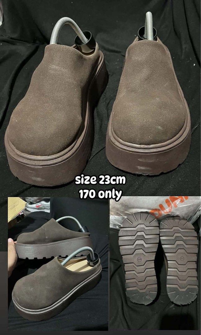 Brown Platform Clogs Size 23cm (Category: Slippers and slides) located in Manila. Submitted by kiyanna.preloved (Listing ID 1464609064, Image 1). Description: - Brown platform clogs - Size: 23cm - Chunky platform for a height boost - Easy slip-on style - Suede-like material - Soles with good grip - Price: P170.
